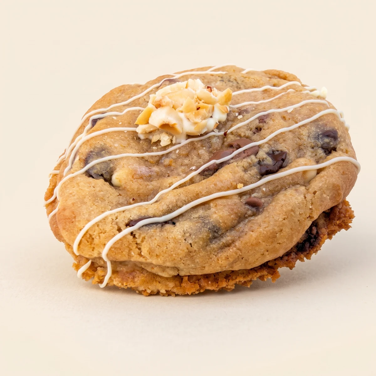 The Bueno cookie with white chocolate drizzle and chopped hazelnuts